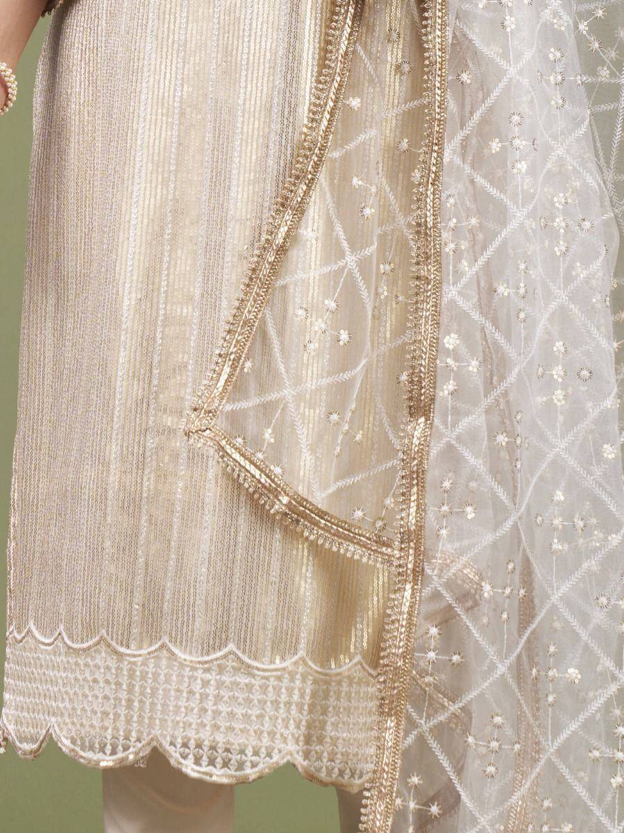 Beige embroidered salwar kameez with scalloped hem and sheer dupatta with floral details