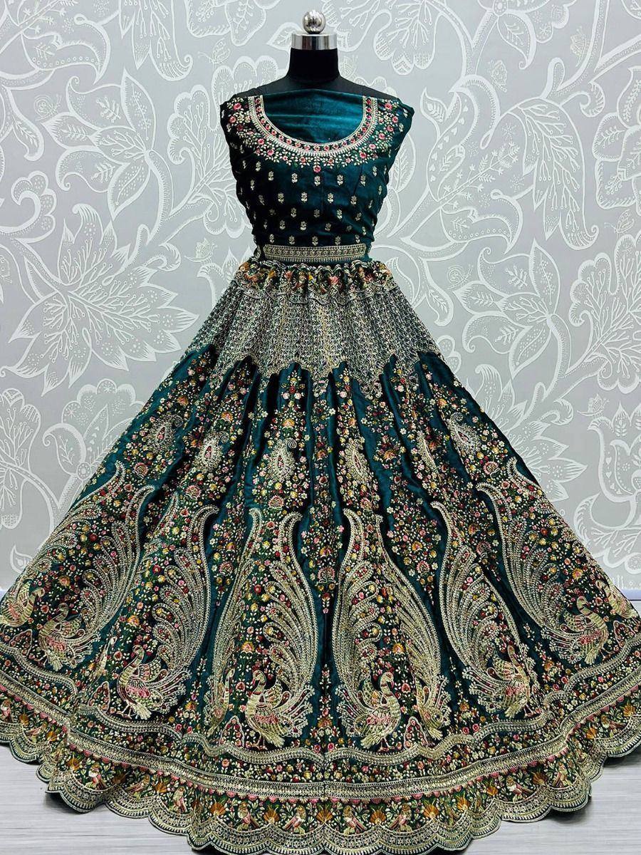 Teal velvet lehenga choli with peacock embroidery, perfect for Indian weddings and festive occasions.