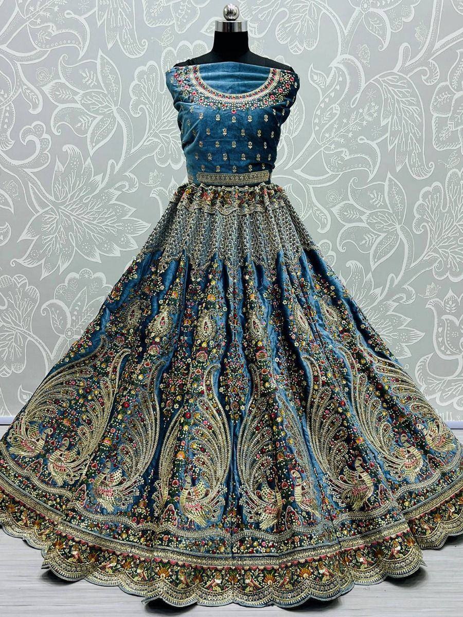 Blue velvet lehenga choli with peacock embroidery, perfect for Indian weddings and festive occasions