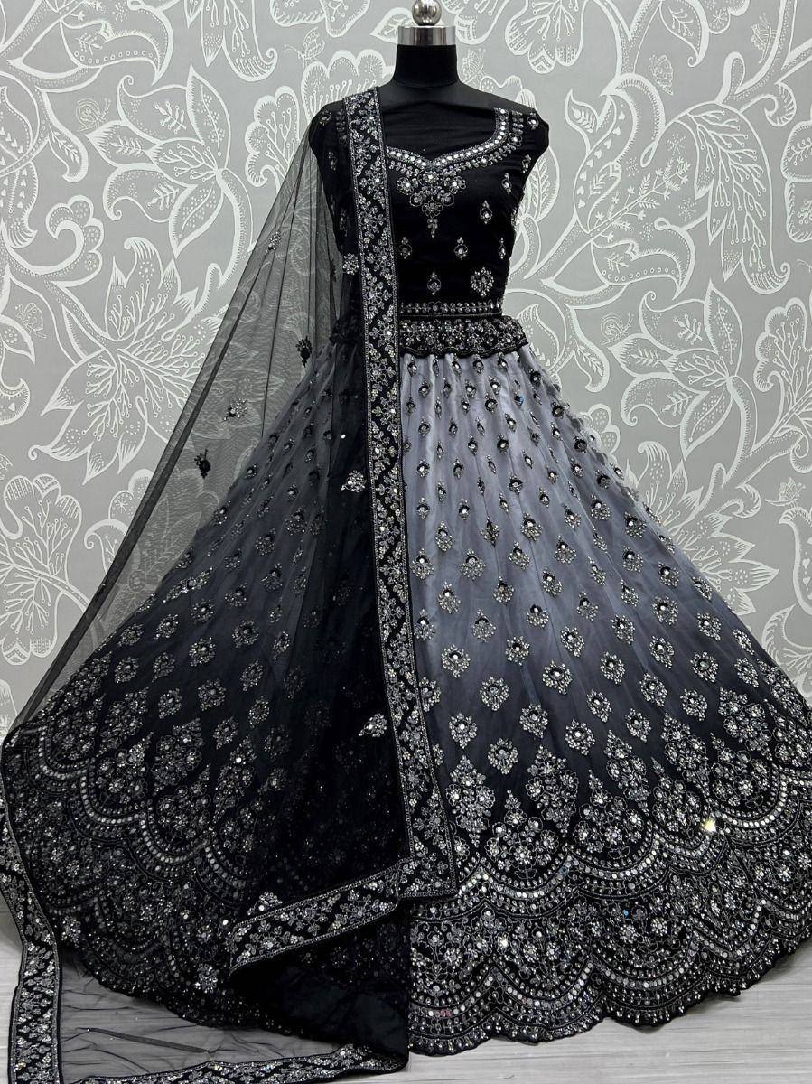 Black designer lehenga choli with heavy embroidery and sheer dupatta, perfect for Indian ethnic occasions.
