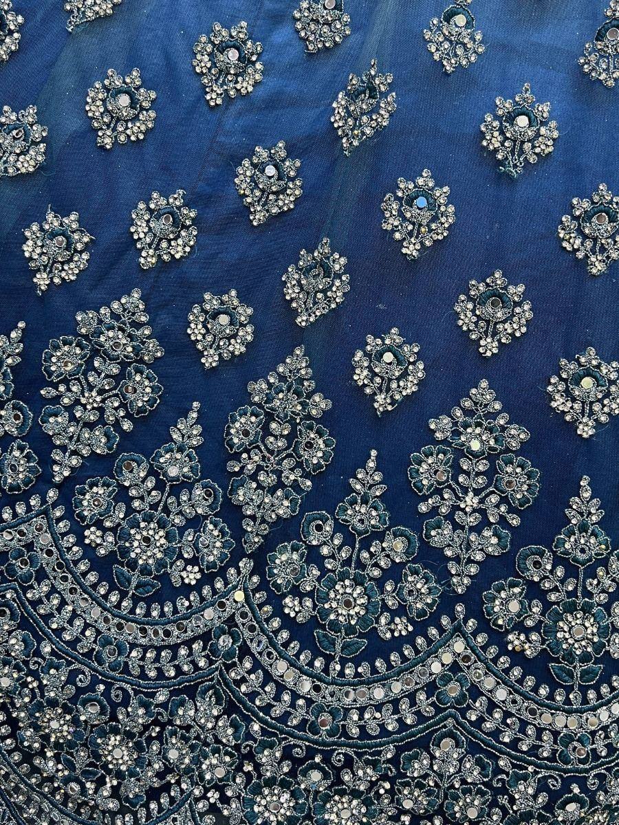 Blue ethnic lehenga choli with intricate floral embroidery and mirror work details