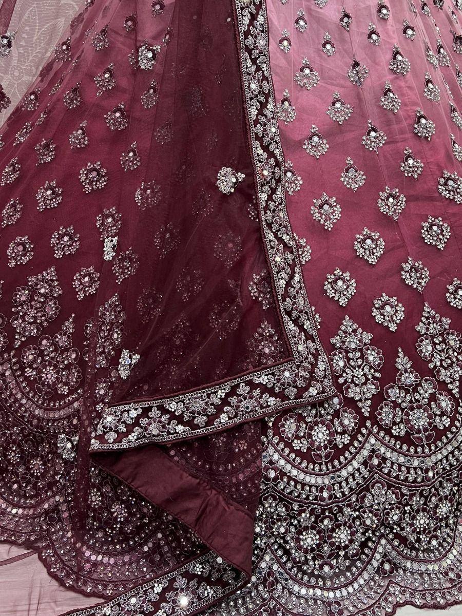 Maroon designer lehenga choli with heavy silver embroidery and stone work, perfect for weddings