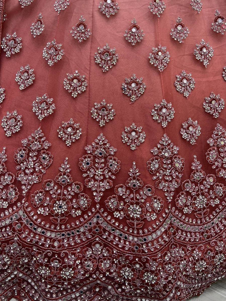 Richly embroidered maroon lehenga with floral mirror work and sequin detailing, perfect for Indian ethnic wear.
