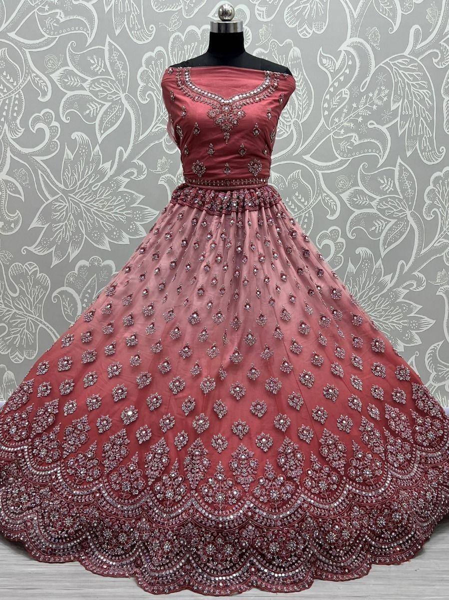 Elegant maroon lehenga choli with intricate embroidery and stone work, perfect for Indian weddings and festive occasions.