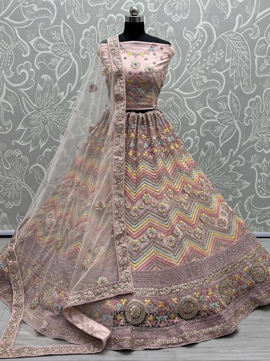 Pink designer lehenga choli with zigzag embroidery and floral motifs, perfect for Indian ethnic wear occasions