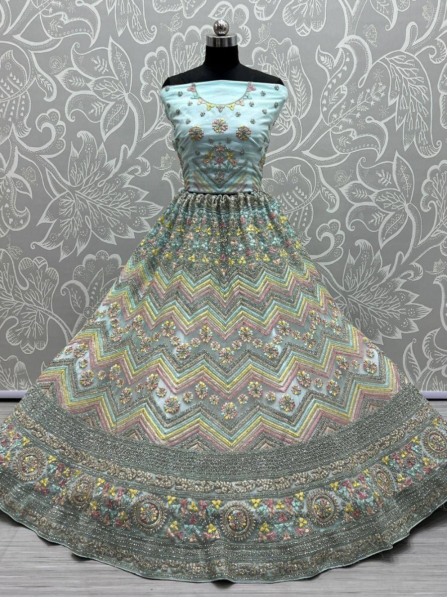 Light blue designer lehenga with zigzag embroidery and floral motifs, perfect for Indian ethnic occasions.