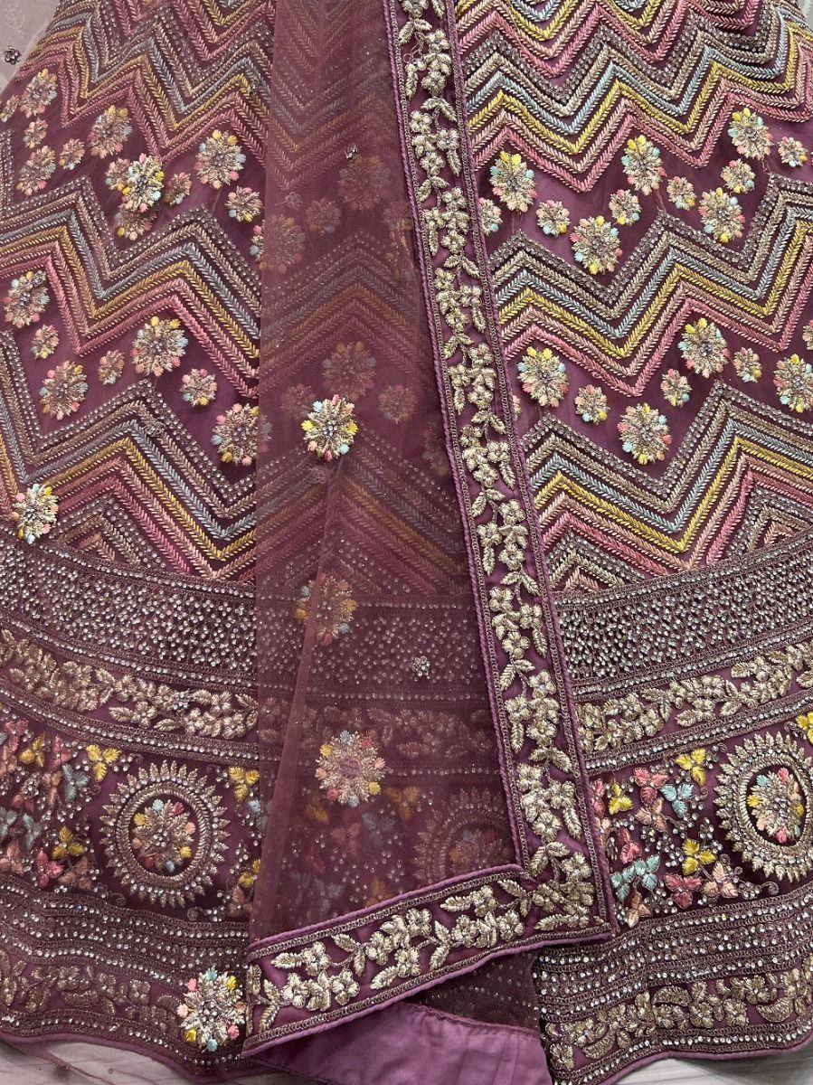Maroon designer lehenga with intricate floral embroidery and zari work, perfect for Indian ethnic wear