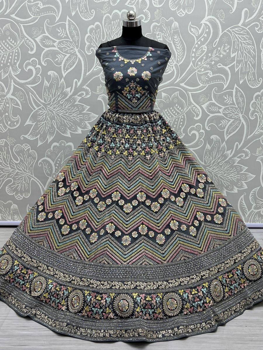 Black designer lehenga choli with colorful floral and zigzag embroidery, perfect for Indian ethnic wear.