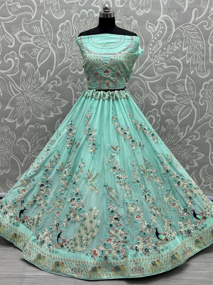 Mint green embroidered lehenga choli with peacock motifs, perfect for Indian ethnic wear occasions