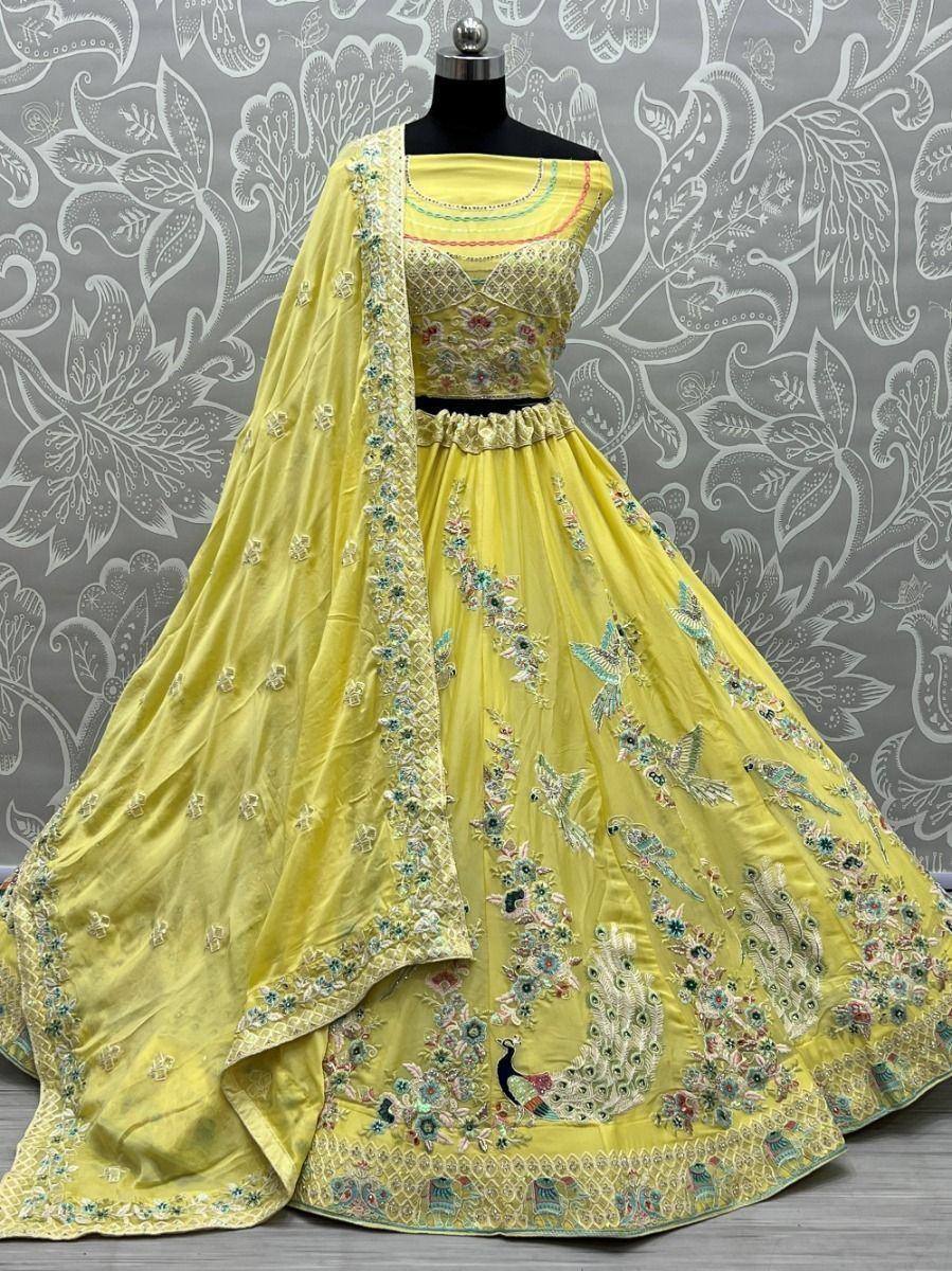 Yellow embroidered lehenga choli with peacock motifs, perfect for Indian ethnic wear and festive occasions.