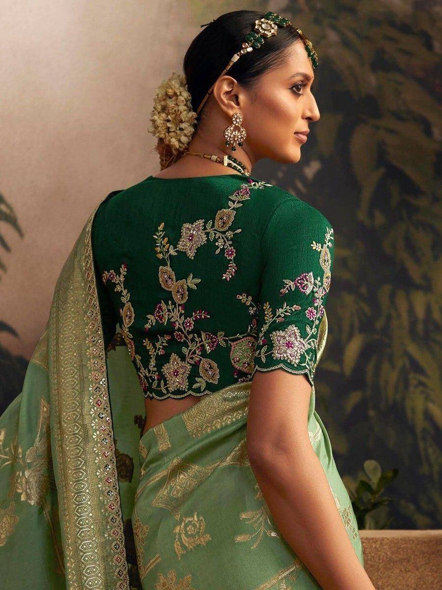 Green embroidered saree with floral blouse, perfect for Indian ethnic wear occasions