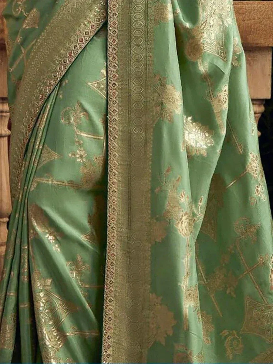 Green silk saree with gold floral embroidery and woven border, ethnic Indian wear