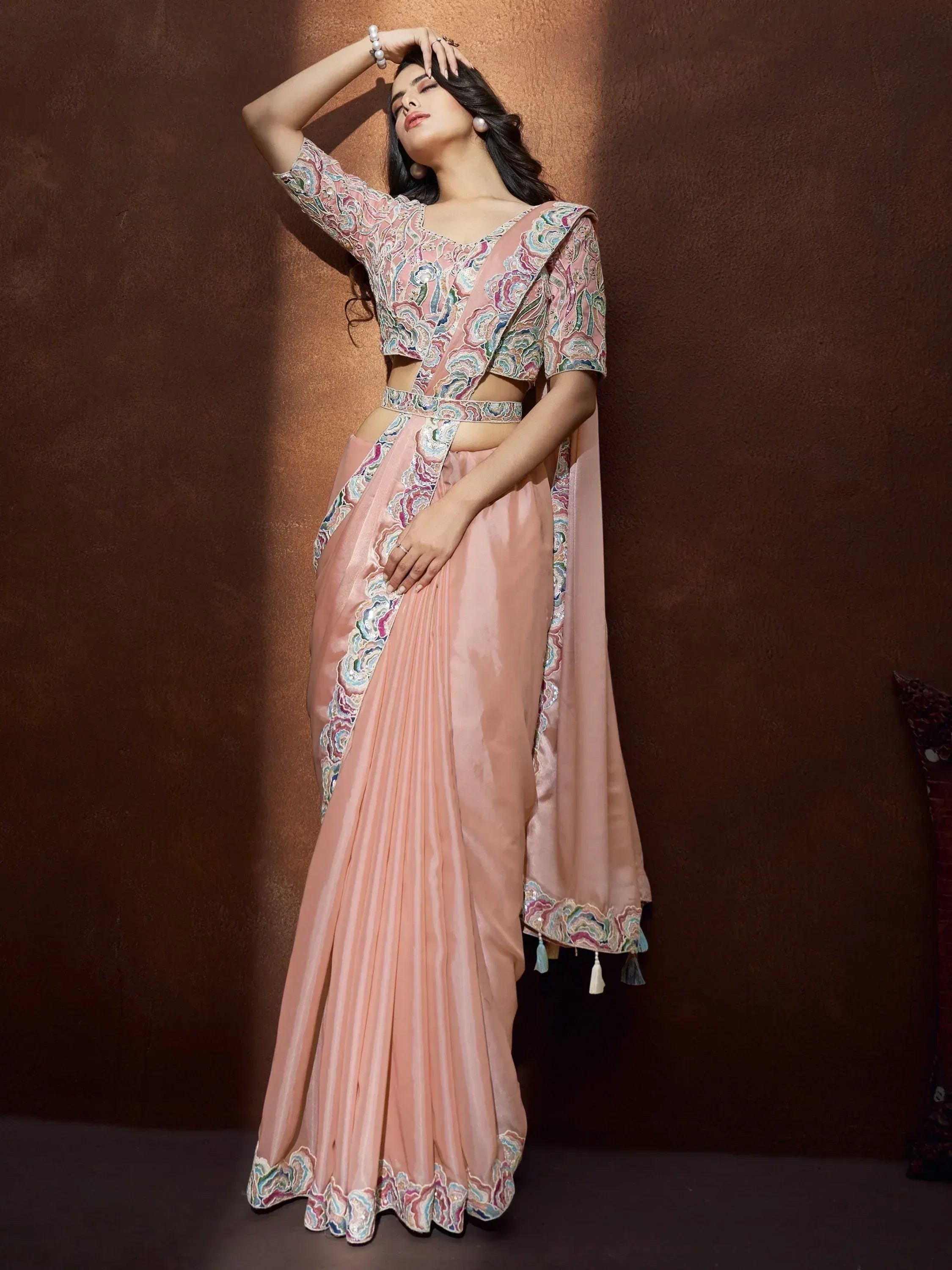 Pink embroidered lehenga choli with floral design, perfect for Indian ethnic wear occasions