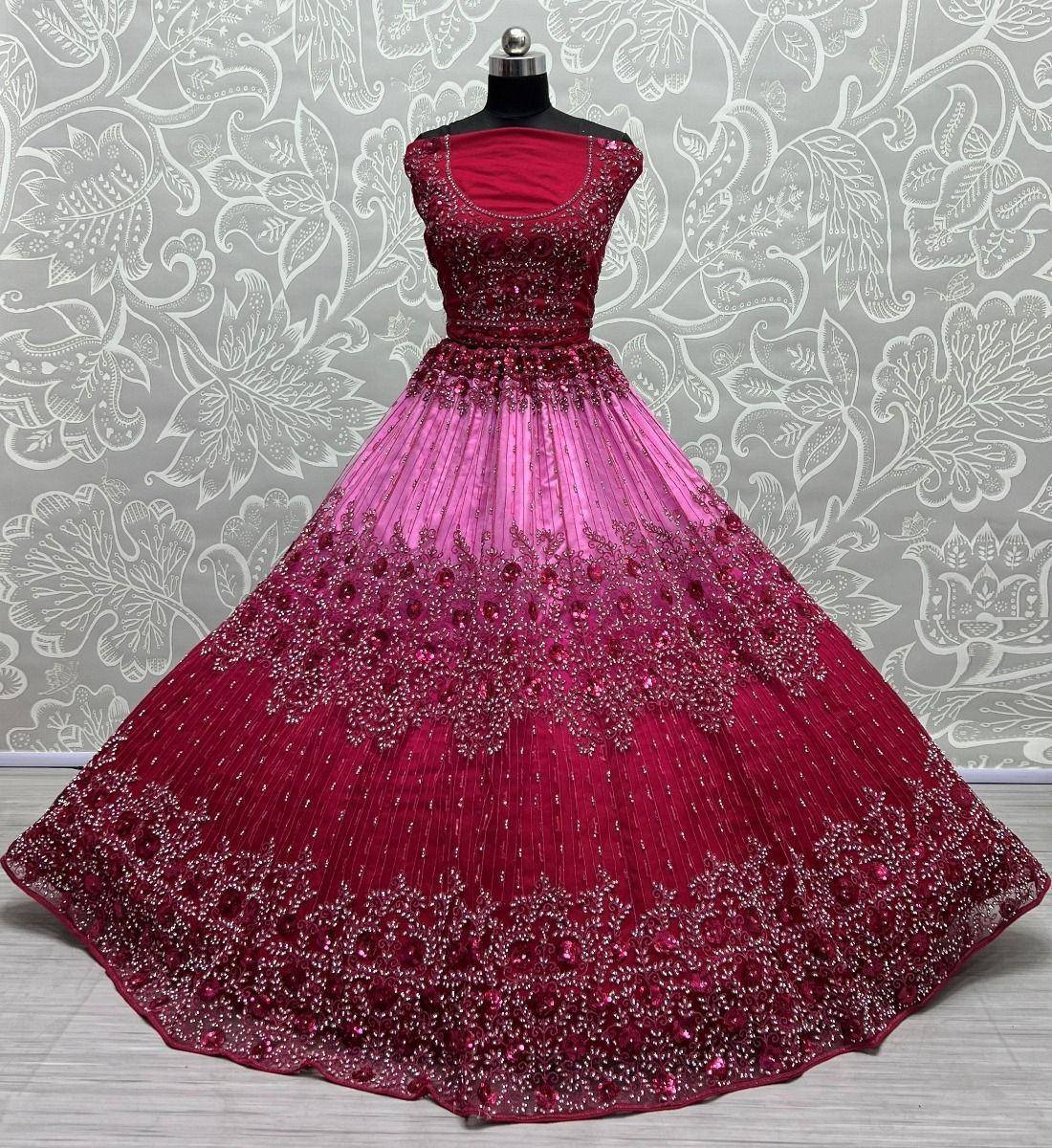 Elegant maroon and pink ombre ethnic gown with heavy beadwork and pleated skirt, perfect for weddings and parties.