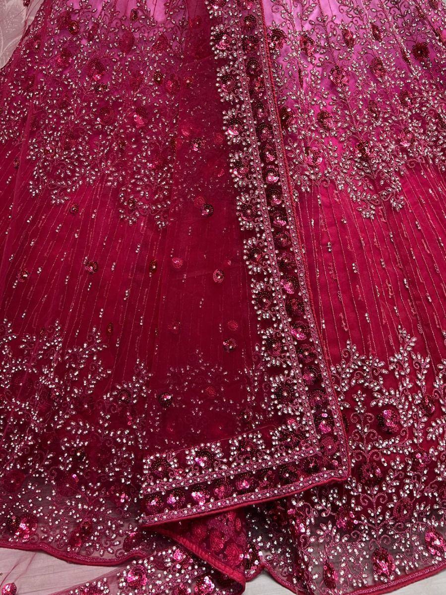 Rich maroon lehenga choli with intricate embroidery and sequin work, perfect for Indian ethnic occasions