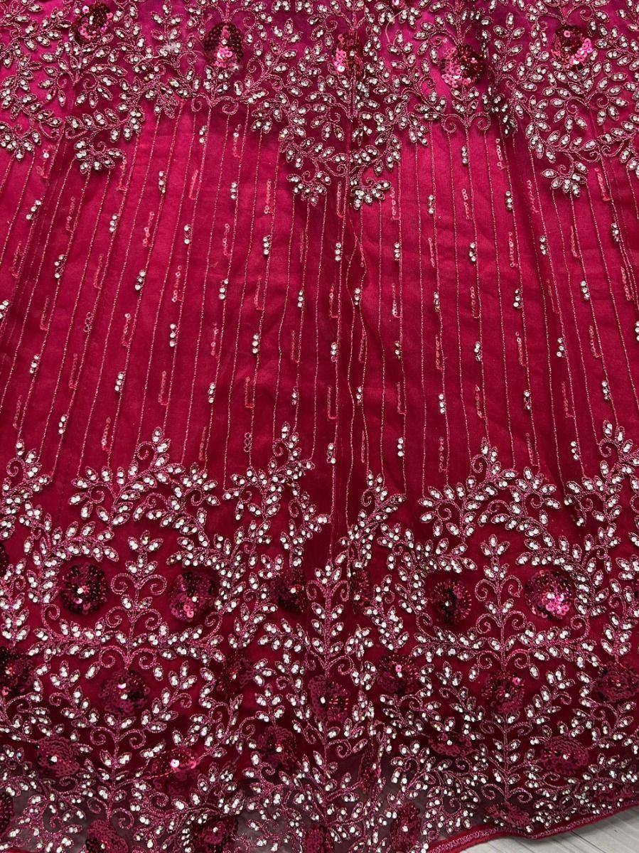 Rich maroon lehenga with intricate floral embroidery and sequin detailing for Indian ethnic wear