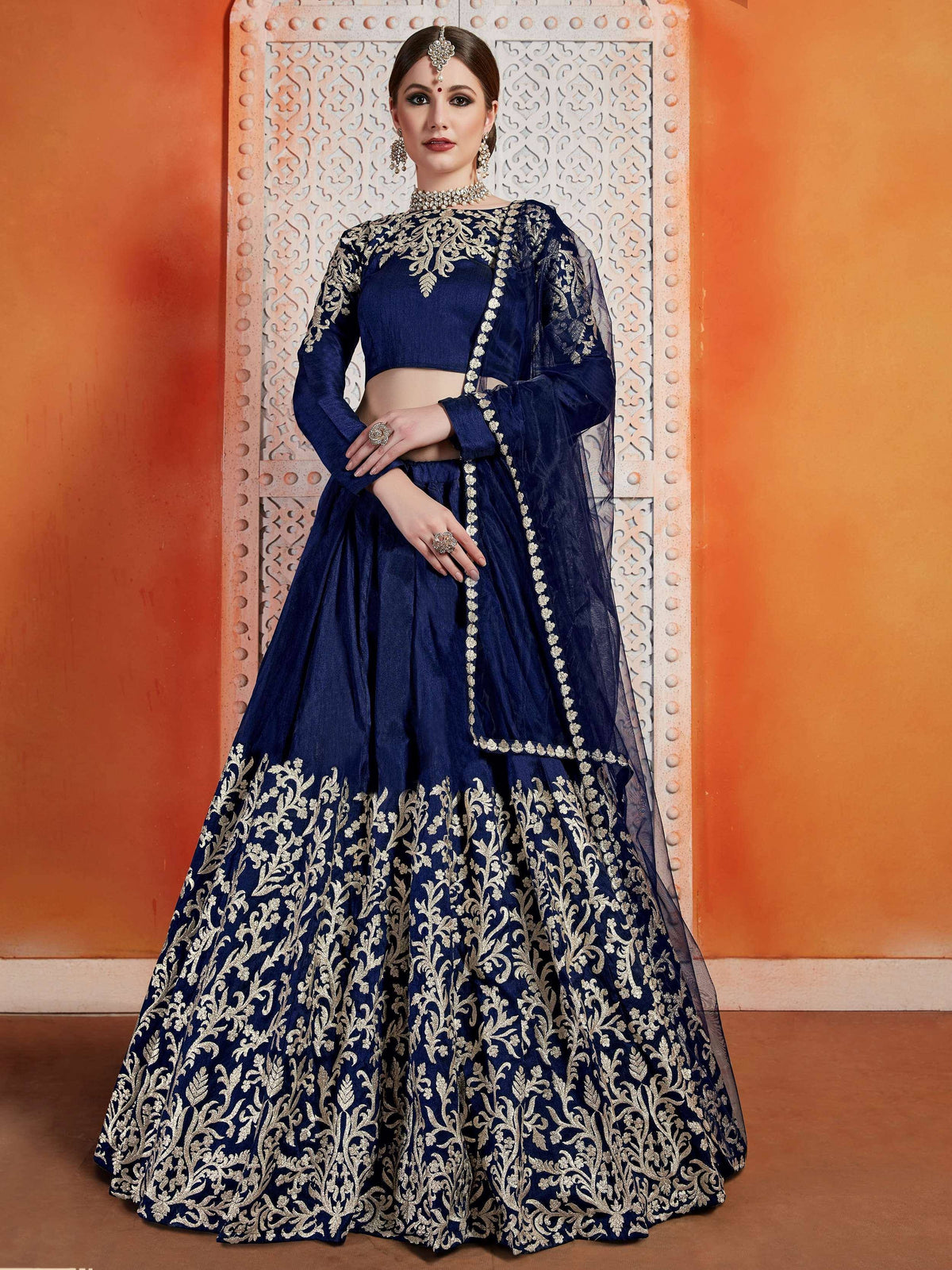 Navy blue lehenga choli with gold embroidery, perfect for Indian weddings and festive occasions.