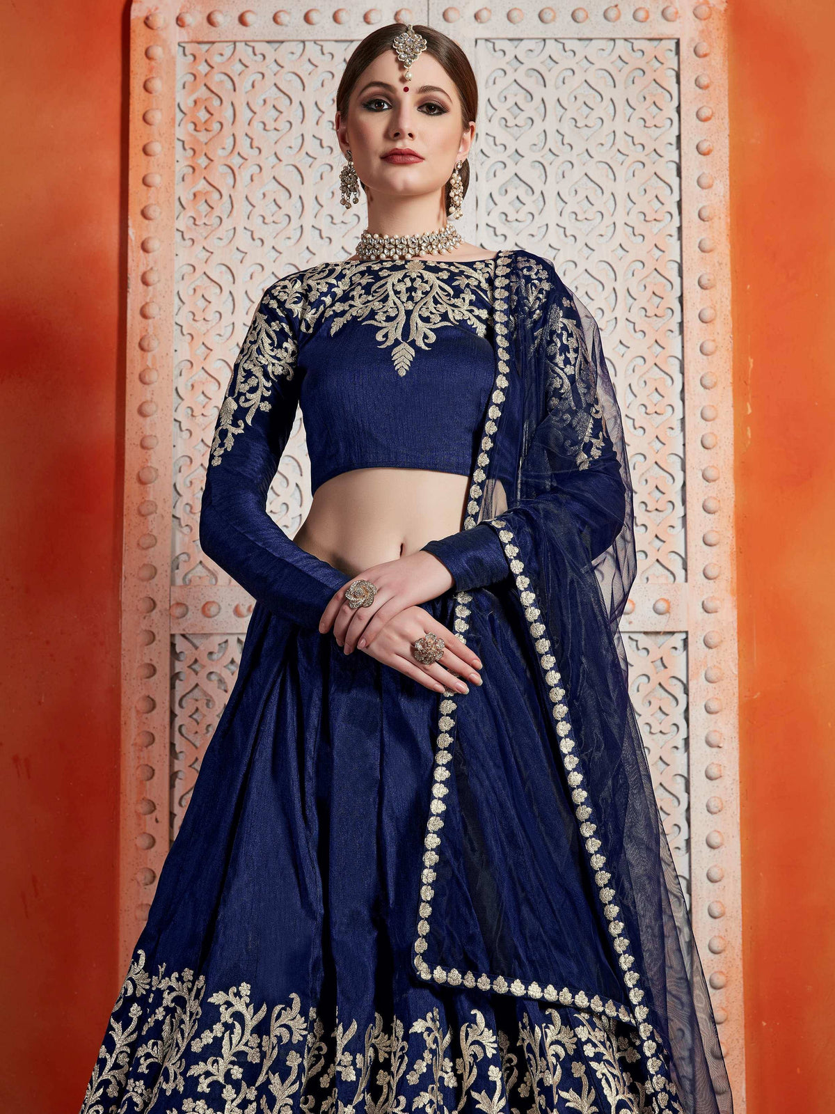 Navy blue designer lehenga choli with gold embroidery, perfect for Indian weddings and festive occasions.