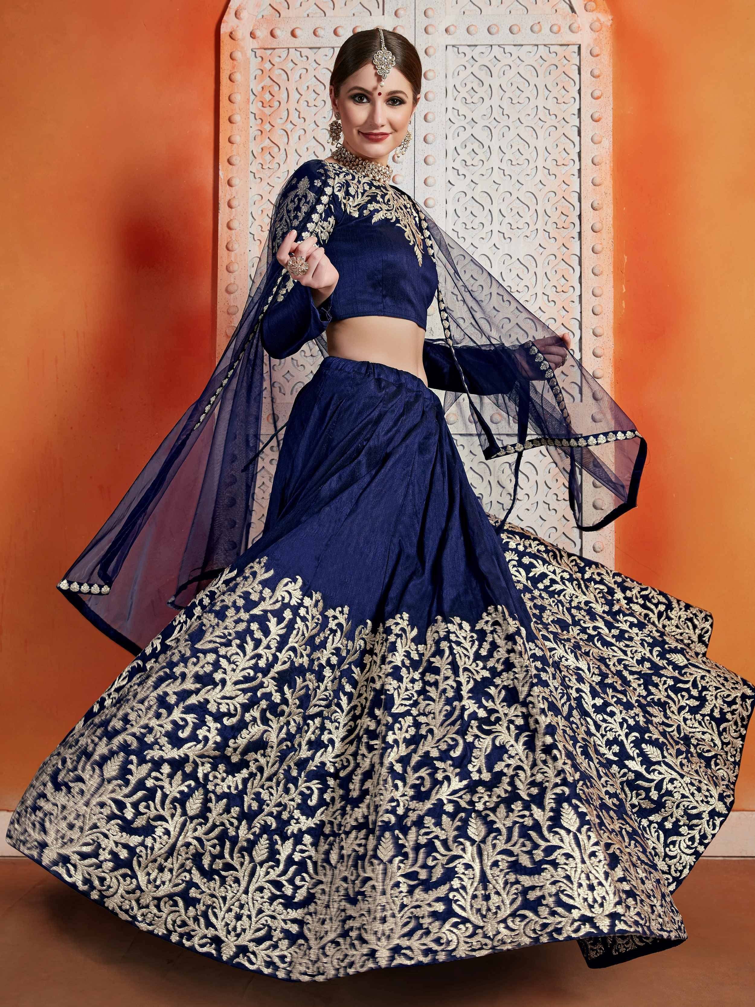 Navy blue designer lehenga choli with gold embroidery, perfect for Indian ethnic wear and festive occasions.