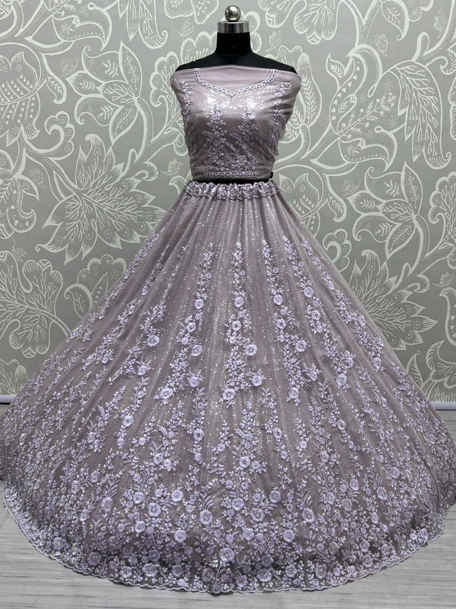 Lavender designer lehenga choli with floral embroidery, perfect for Indian weddings and festive occasions.