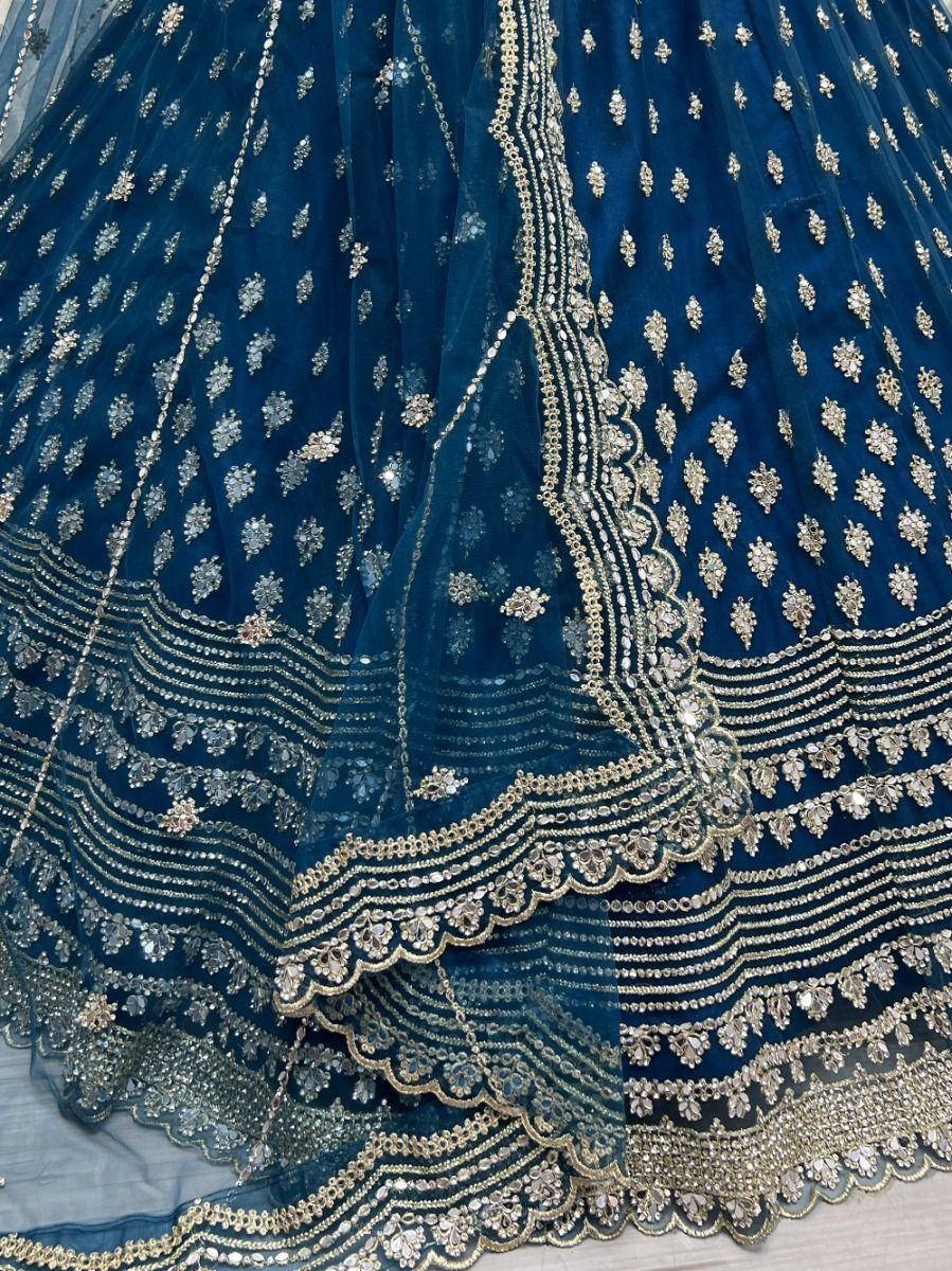 Stunning Blue Zircon Heavy Embroidered Net Lehenga Choli