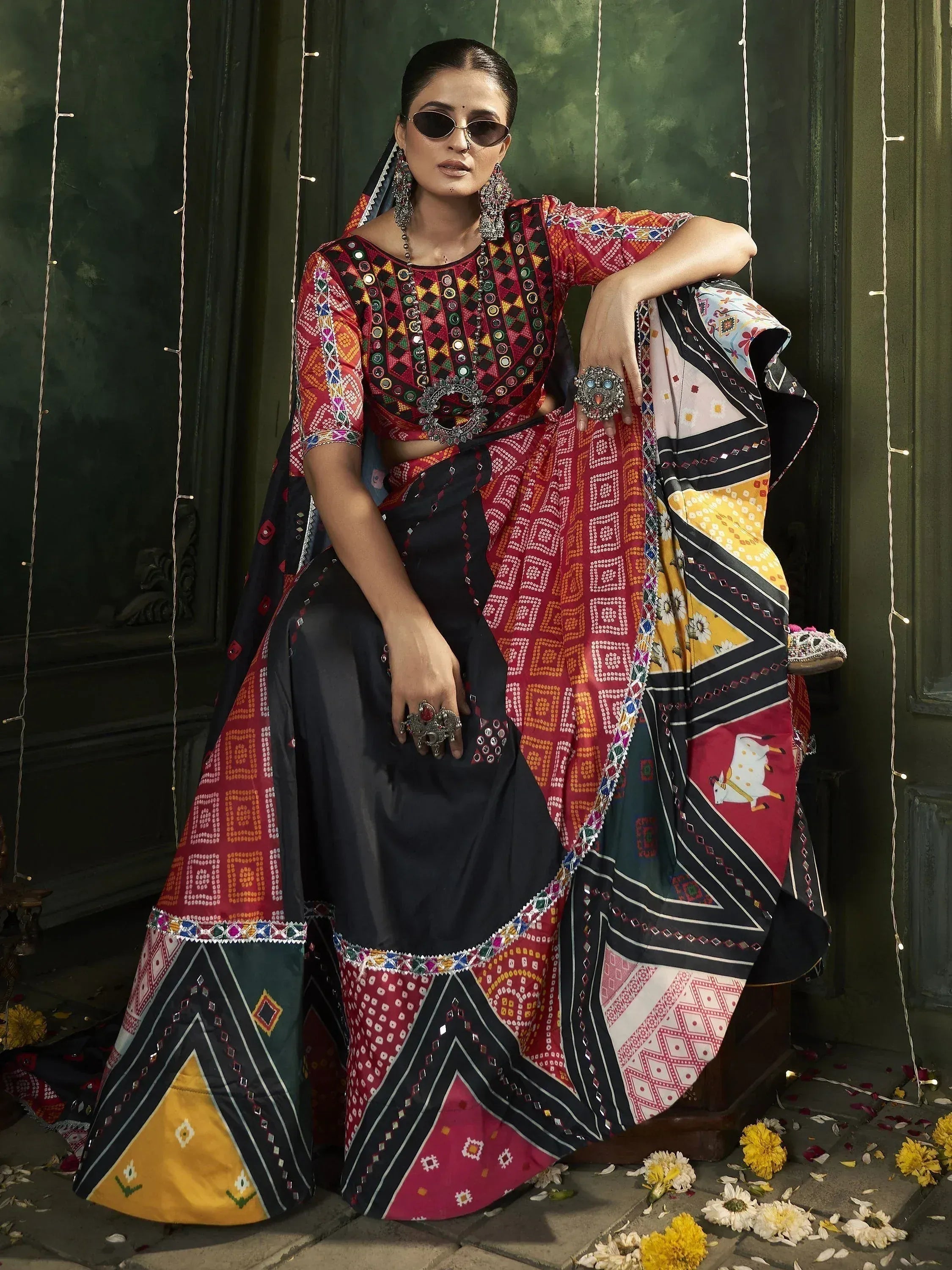 Vibrant ethnic lehenga choli with mirror work, geometric prints, and colorful border details for festive occasions