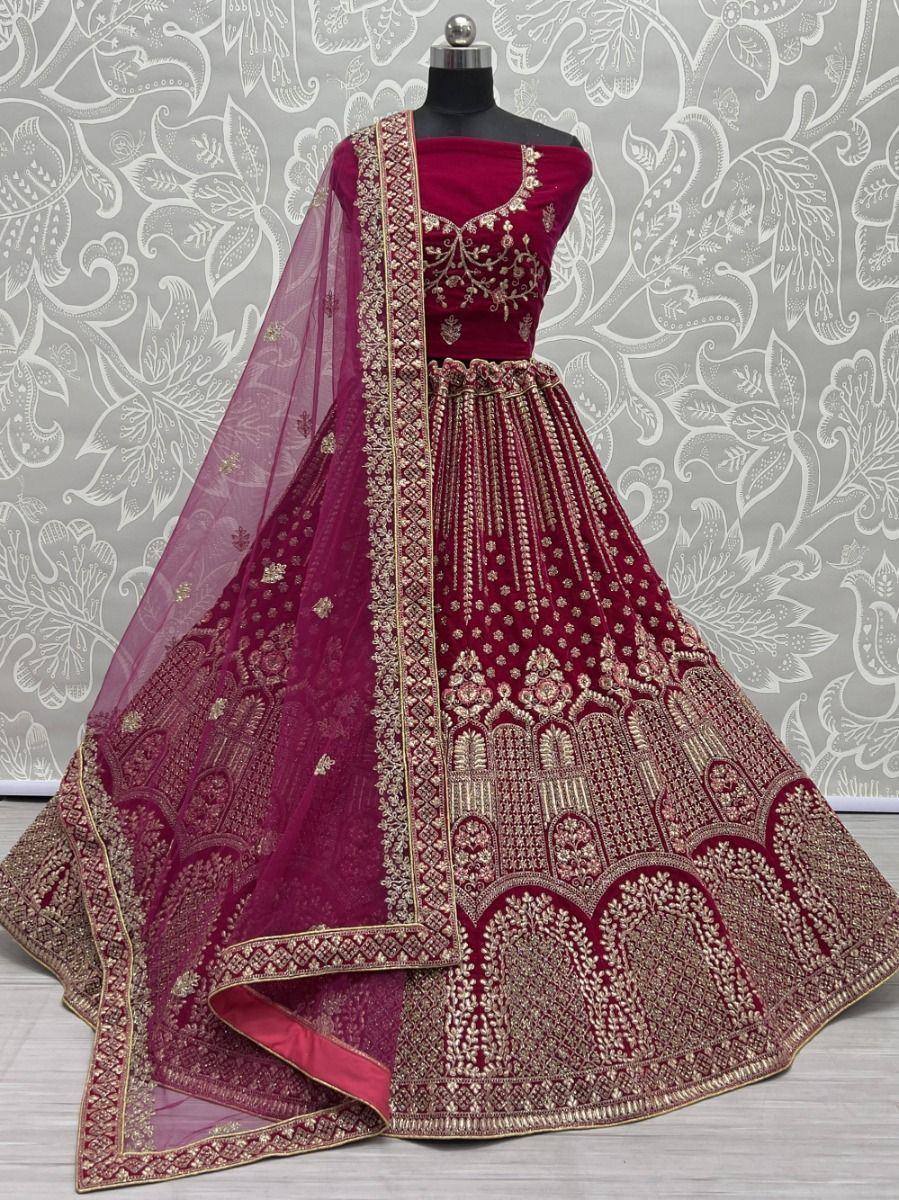 Maroon designer lehenga choli with gold embroidery and sheer dupatta, ethnic Indian wedding wear