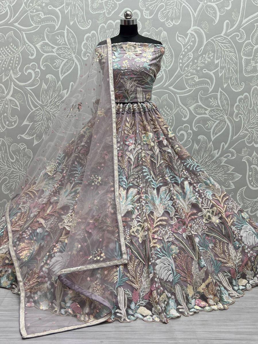 Elegant floral embroidered lehenga choli with sheer dupatta, perfect for Indian ethnic occasions.
