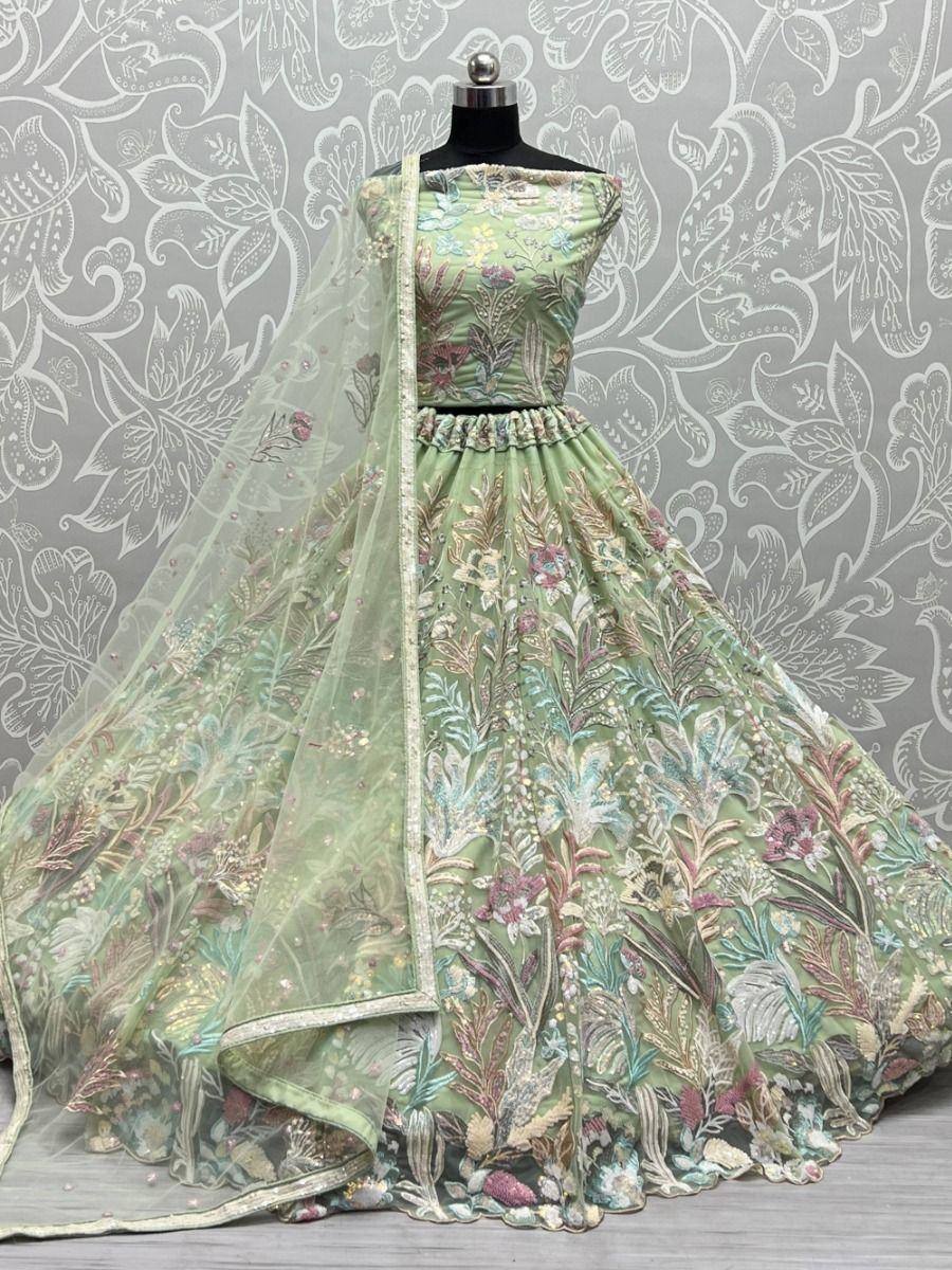 Mint green embroidered lehenga choli with floral motifs and sheer dupatta, ideal for Indian ethnic wear occasions