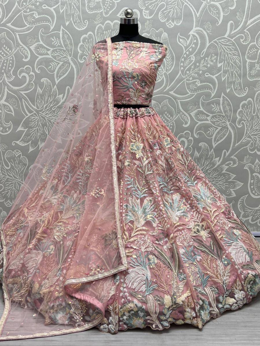 Pink embroidered lehenga choli with floral motifs and sheer dupatta, perfect for Indian ethnic occasions