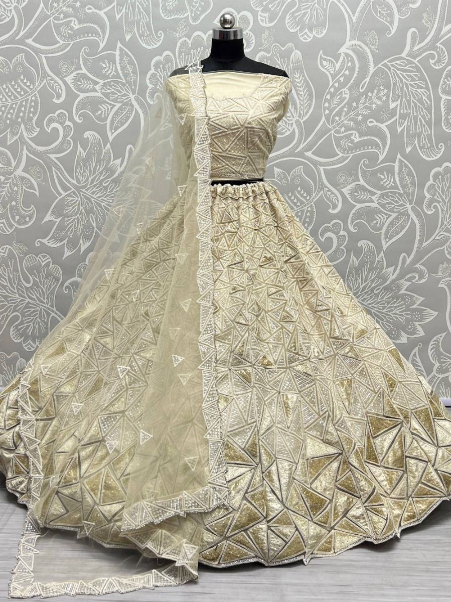 Fascinating Beige Sequins Embroidered Net Lehenga Choli
