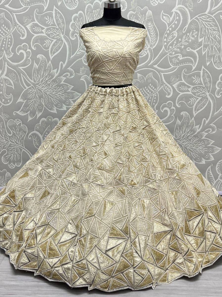Gold geometric embroidered lehenga choli with flared skirt, perfect for Indian ethnic wear occasions