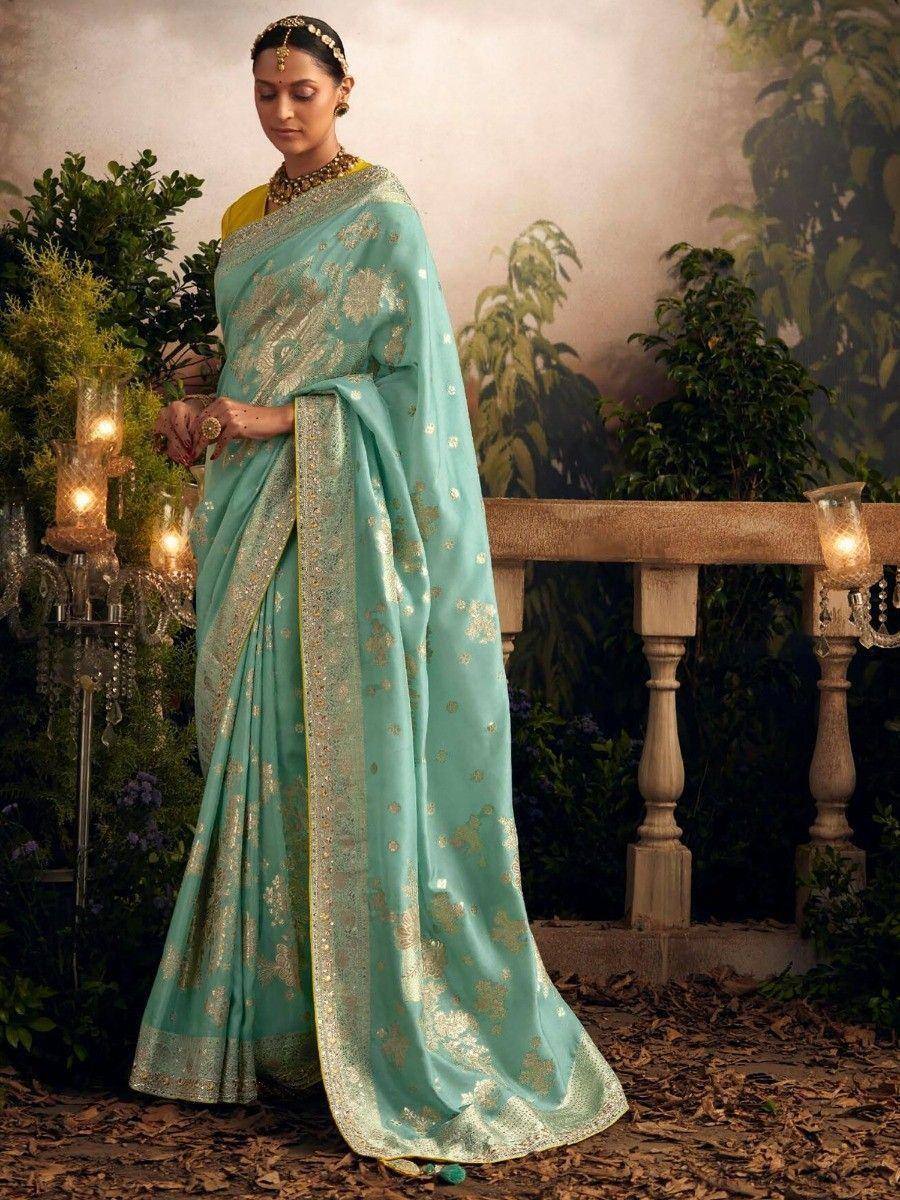Elegant turquoise saree with gold embroidery, perfect for Indian ethnic wear occasions