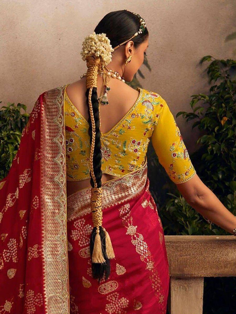 Yellow embroidered blouse with red saree, floral hair accessory, traditional Indian ethnic wear