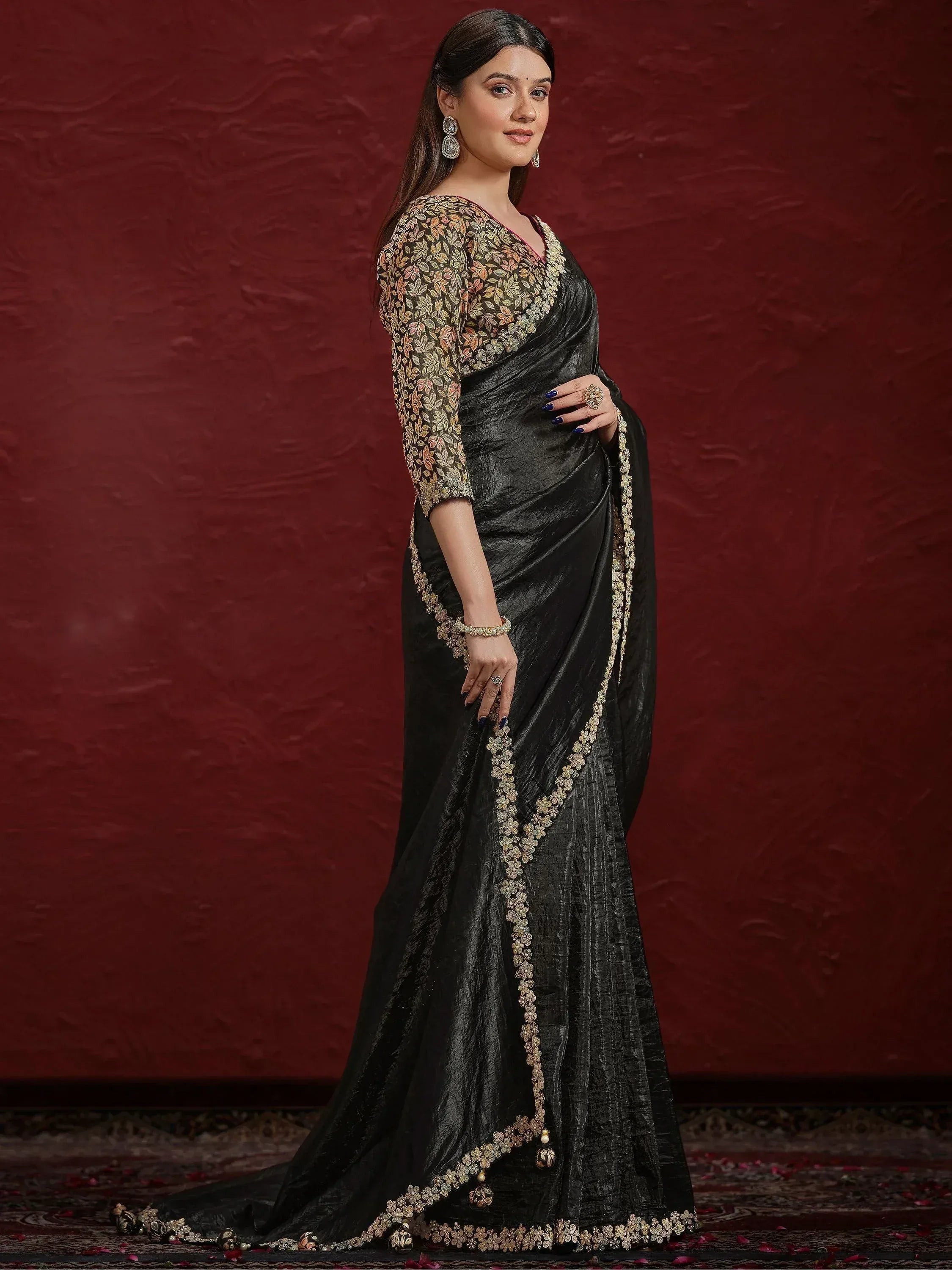Black designer saree with gold floral embroidery and matching blouse, elegant ethnic wear for women