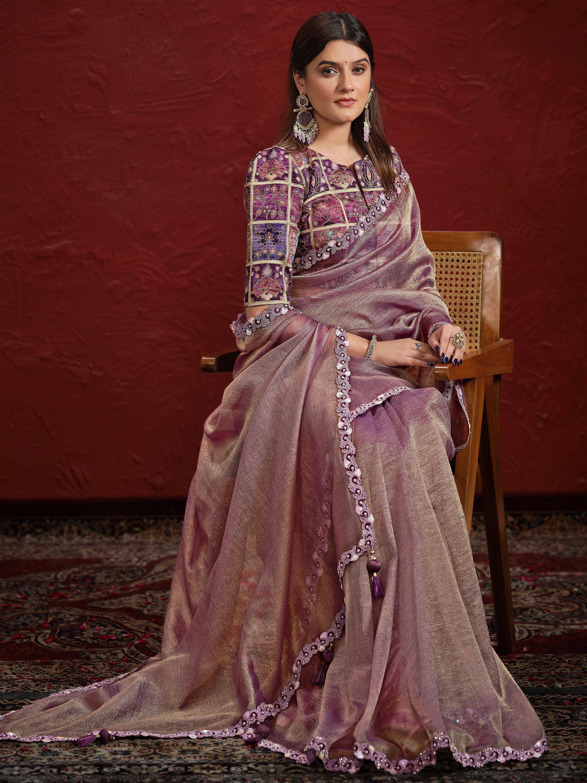Elegant purple designer saree with intricate embroidery and tassels, perfect for Indian ethnic occasions