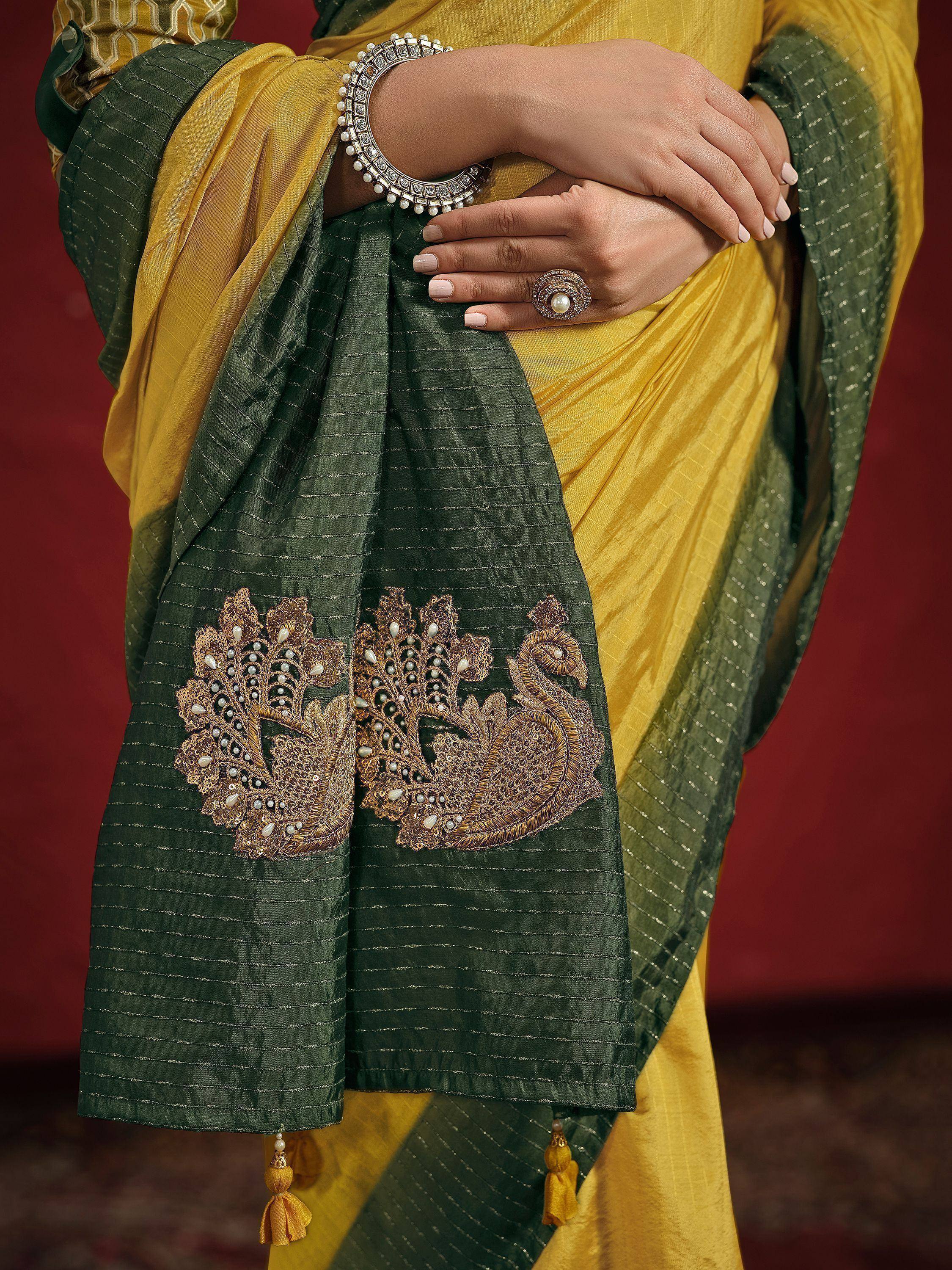 Yellow and green saree with peacock embroidery, pearl jewelry, and tassels for ethnic wear
