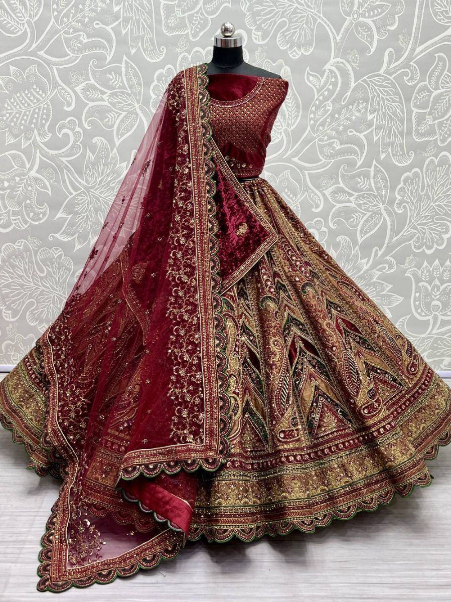Maroon velvet lehenga choli with gold embroidery, perfect for weddings and festive occasions