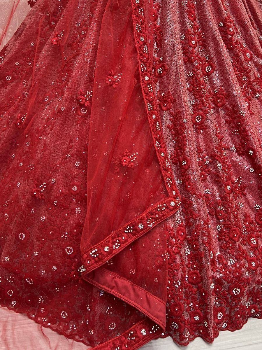 Red embroidered lehenga with floral sequin detailing and sheer net overlay