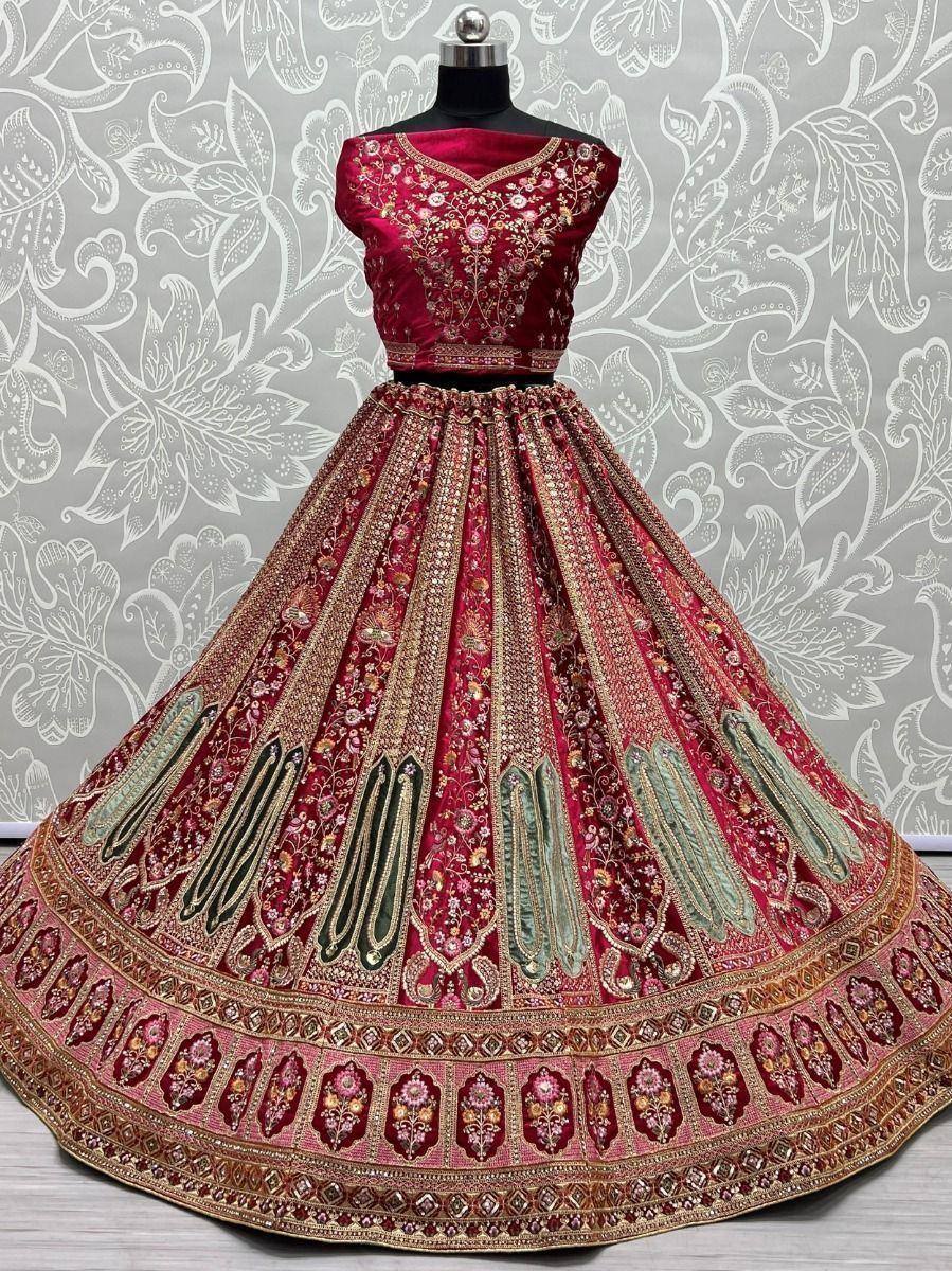 Red embroidered lehenga choli with gold detailing, perfect for Indian weddings and festive occasions