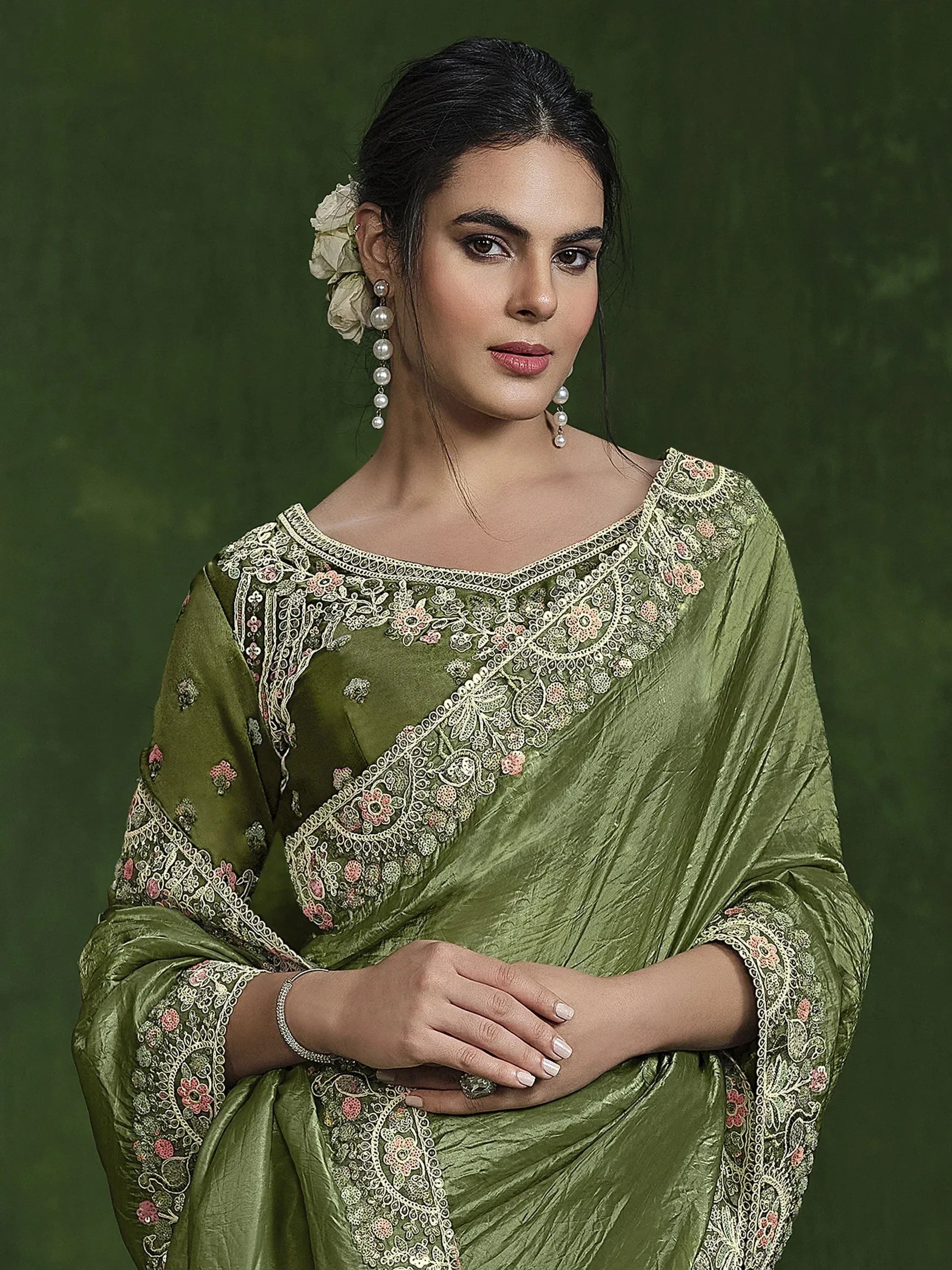 Olive green embroidered saree with floral detailing, perfect for Indian ethnic wear occasions.