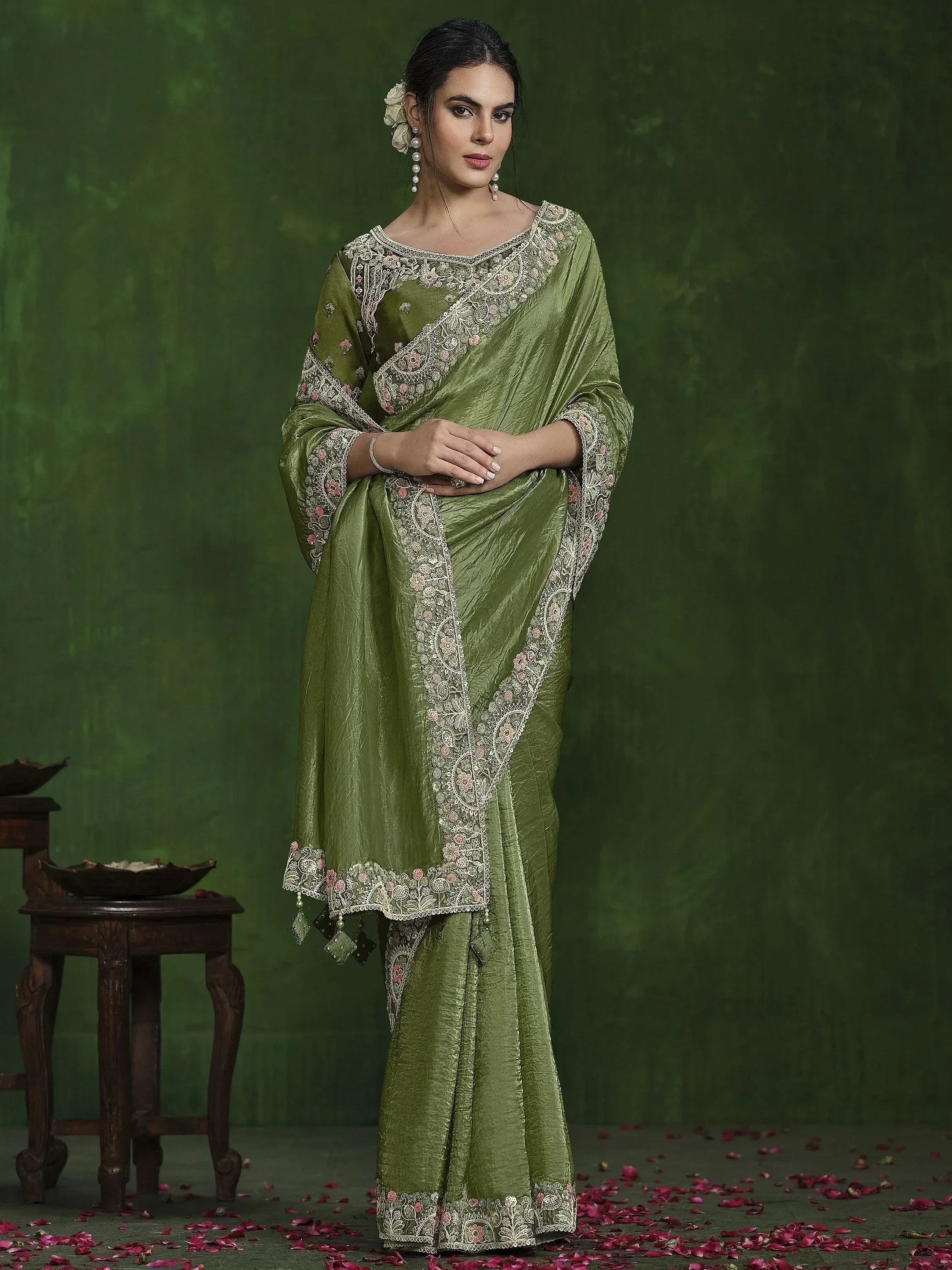 Olive green embroidered saree with floral lace detailing, perfect for Indian ethnic occasions