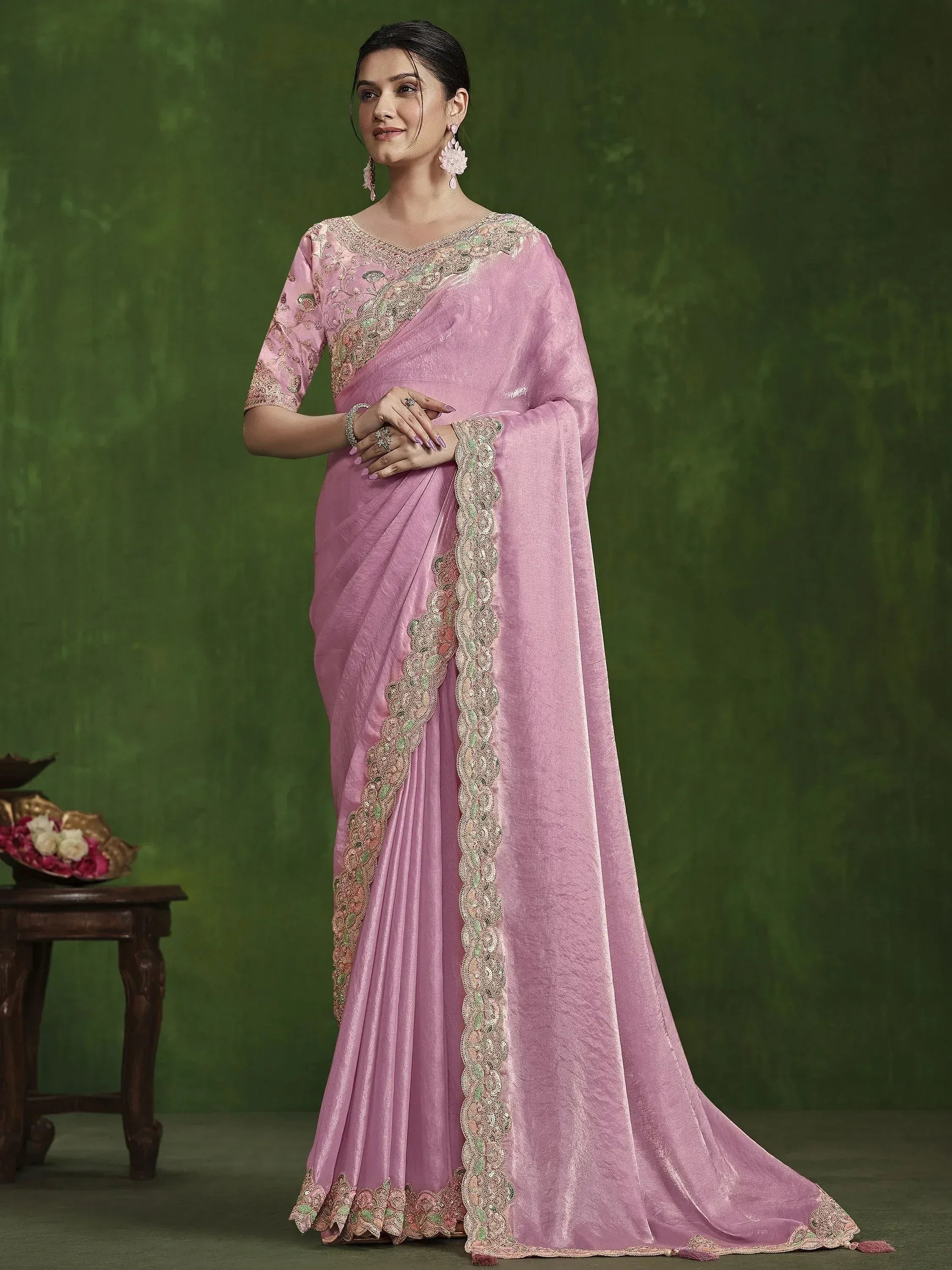 Pink embroidered saree with gold and green detailing, perfect for Indian ethnic occasions