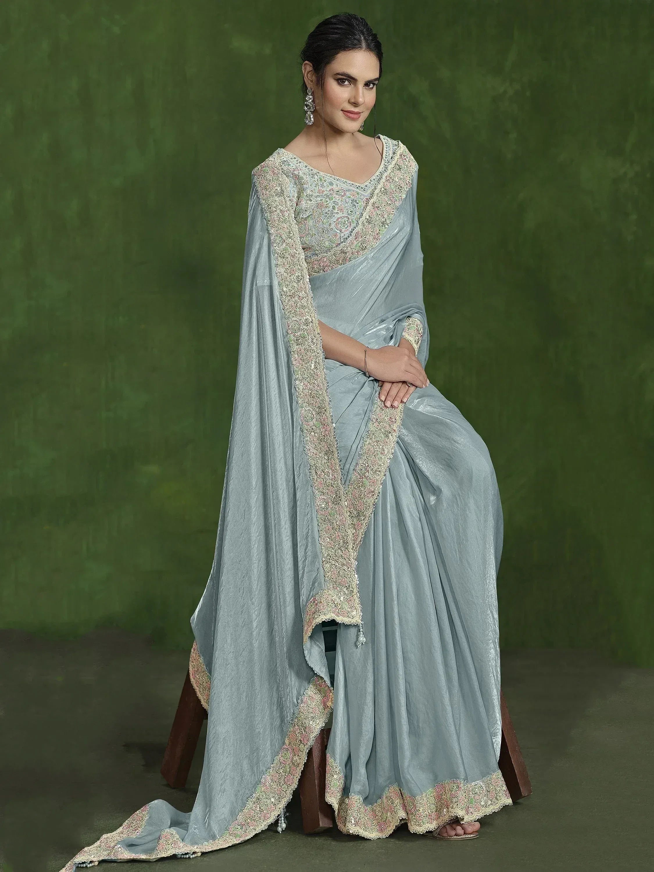 Elegant light blue saree with floral embroidery and sequin detailing, perfect for Indian ethnic wear.