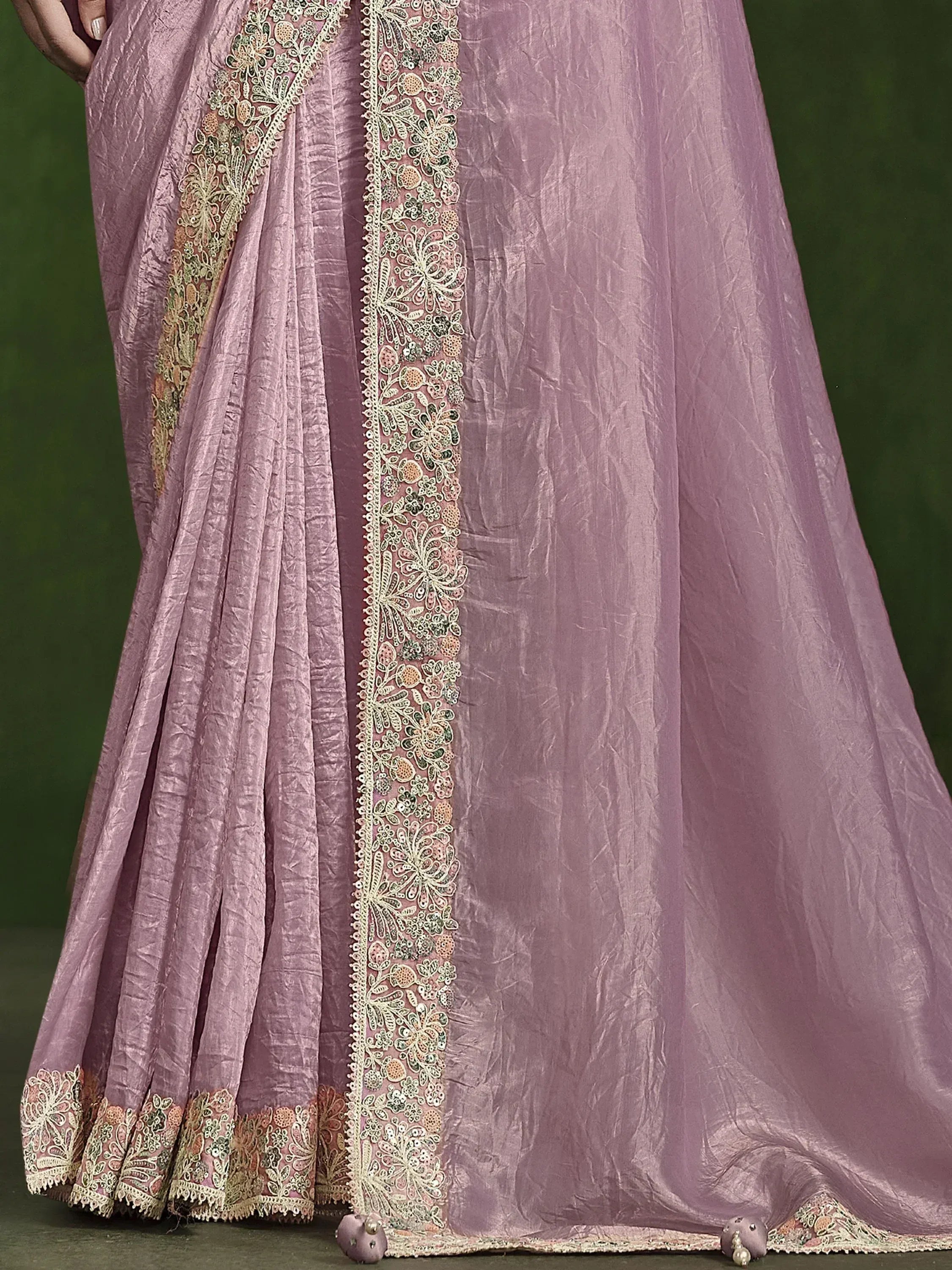 Dusty pink ethnic gown with intricate floral embroidery and lace detailing, perfect for Indian occasions.