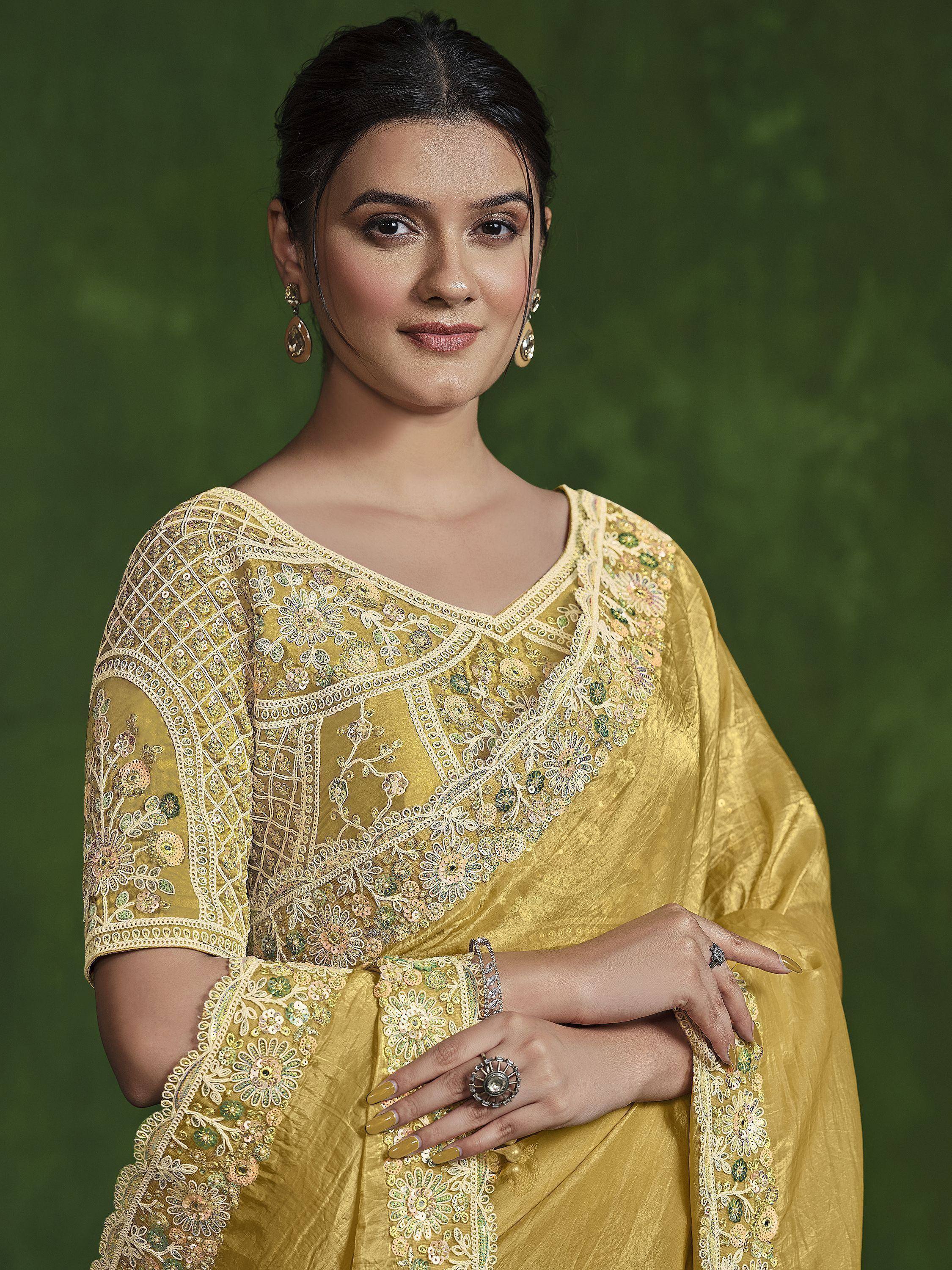Yellow embroidered ethnic gown with floral detailing, perfect for Indian festive occasions and weddings.