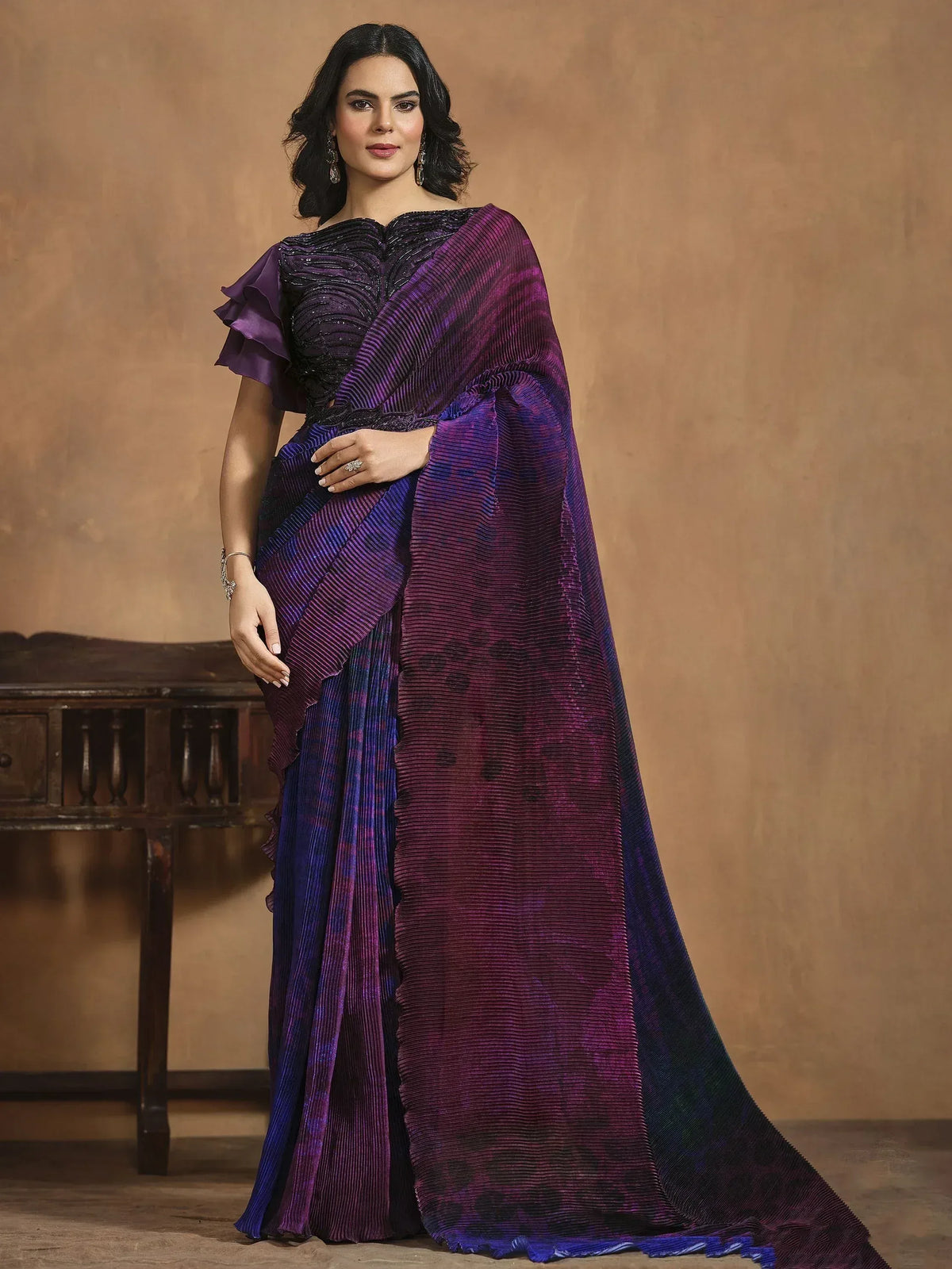 Elegant purple and blue pleated saree with sequined blouse, perfect for Indian ethnic wear