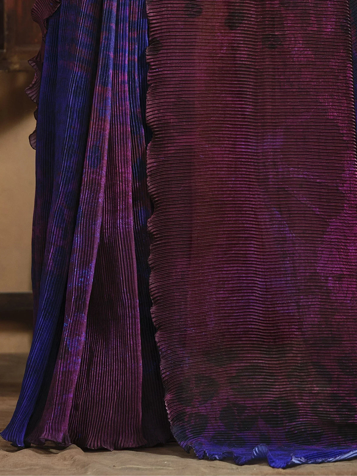 Purple and blue pleated ethnic gown with shimmering fabric and ruffled hem detail