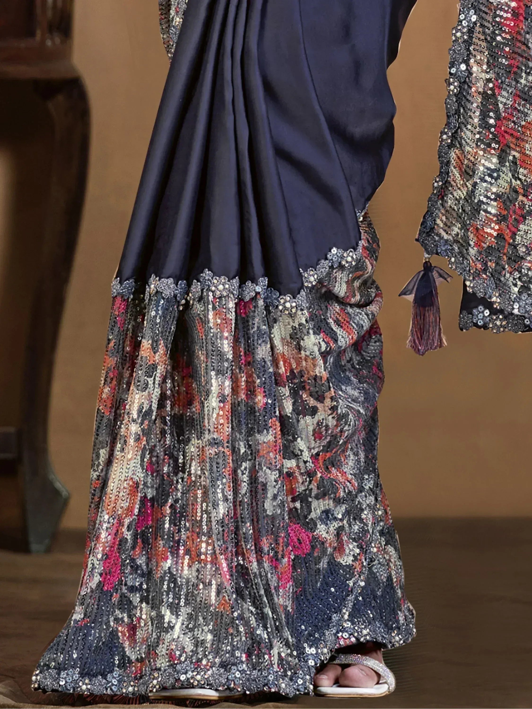 Navy blue ethnic gown with sequin floral border, perfect for festive occasions and weddings