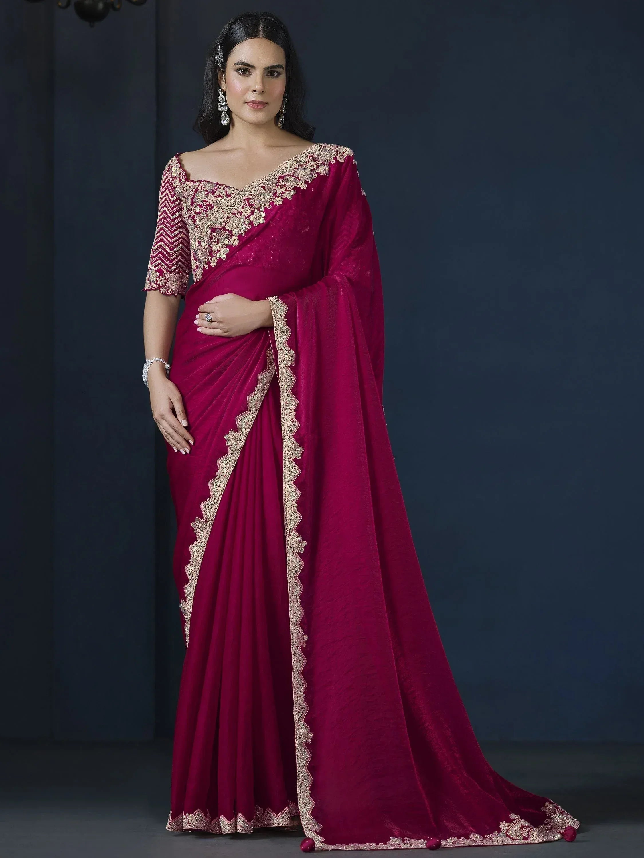 Elegant maroon velvet saree with gold embroidery, perfect for Indian ethnic occasions and weddings.